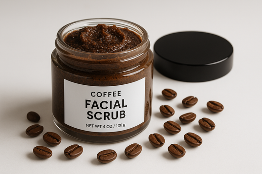 coffee facial scrub labeled with top off and coffee beans scattered around
