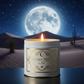 16oz white tin with candle lit labeled elaboratly Desert Moon by OBC with an elaborate background