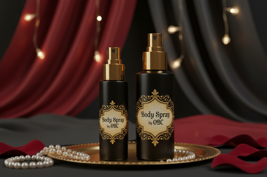 1oz and 2oz black bottle with a gold spray top elaborately labeled body spray by OBC with sexy elaborate background