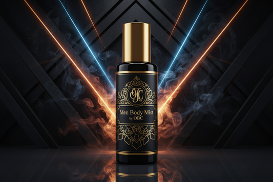 1oz black spray bottle with gold top elaborately labeled Men Body Mist by OBC with a powerful background